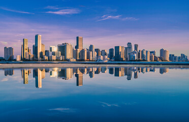 Fototapeta premium city skyline sunrise new miami Florida skyscrapers reflection water sea beautiful 