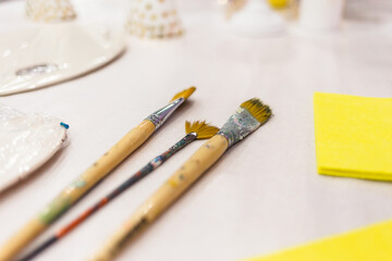 Paintbrushes are lying on the table