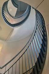 Fototapeta premium View up the beautiful spiral staircase in the building.