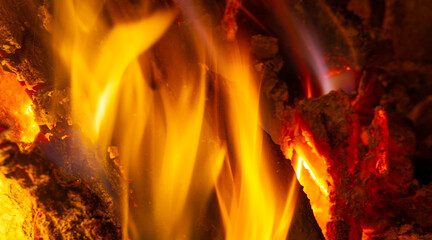 Fire in the fireplace. The illuminated area around the fire creates its own small zone In the...