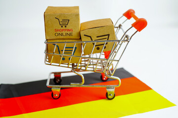 Online shopping, Shopping cart box on Germany flag, import export, finance commerce.