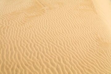 Fototapeta na wymiar Sand pattern texture in Morocco. Desert Sahara sand ripples background.