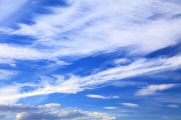 White clouds blue sky background. White fluffly clouds texture.