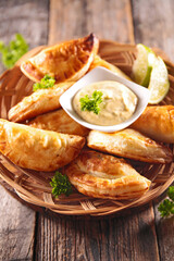 Homemade stuffed beef empanadas and dipping sauce
