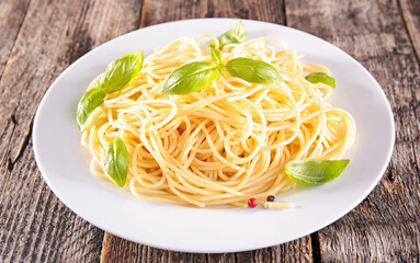 plate of spaghetti with fresh basil