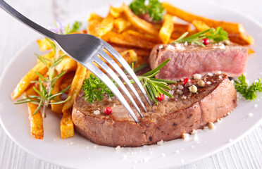 grilled beef steak with french fries