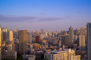 Fototapeta na wymiar Cityscapes of tokyo sunset winter, Skyline of Tokyo, office building and downtown of tokyo in minato, Japan, Tokyo is the world's most populars metropolis and centers for world business.