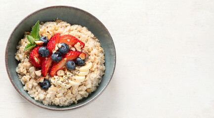 Healthy homemade oatmeal with berries for breakfast.