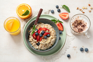 Healthy homemade oatmeal with berries for breakfast.