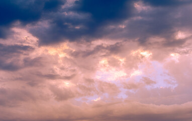 Fototapeta na wymiar Clouds dawn sunset romance. No cloud is so dark that eventually the sun cannot shine through it.