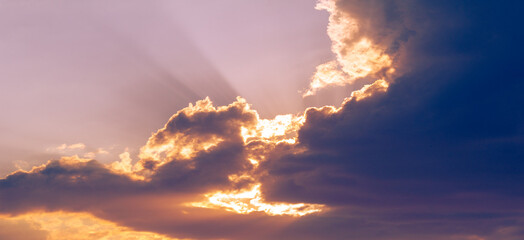 Fototapeta na wymiar Clouds dawn sunset romance. No cloud is so dark that eventually the sun cannot shine through it.