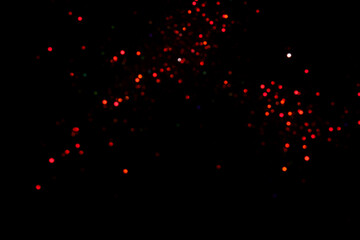 Red blurred bokeh lights on black background. Glitter sparkle confetti for celebrate. Overlay for...