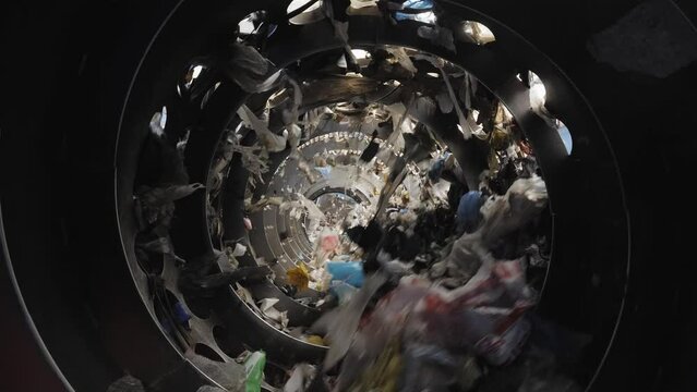 Garbage Recycling Factory, not compostable home equipment, aluminium cans, Plastic cubes for recycle Plant, rubbish warehouse collection. Preparation of recyclables for recycling