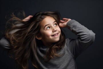 Medium shot portrait photography of a happy kid female scratching head in gesture of confusion against a dark grey background. With generative AI technology