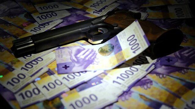 Elegant Semiautomatic 9mm Handgun Leaning on Swiss Franc 1000 Banknote in Switzerland.