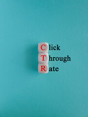 CTR click through rate symbol. Wooden cubes with red words 'CTR click through rate'. Beautiful blue background. Business and CTR click through rate concept. Copy space.