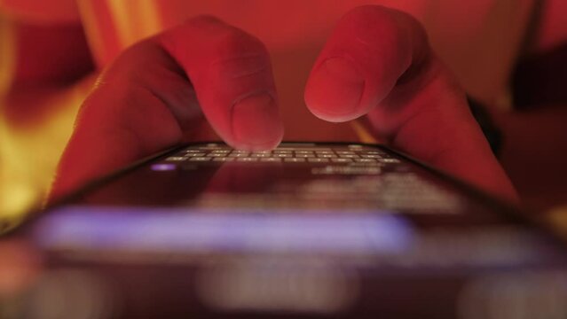 Woman chatting online on smartphone macro close up, typing text message, touching touchscreen keyboard, using messenger application. Female holding mobile phone, close up, swiping social media. 