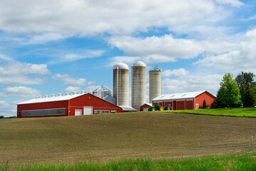 Farm with red barn and field