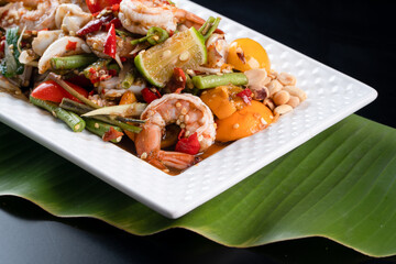 Thai Style spicy seafood salad with shrimps, Papaya Salad with fresh Shrimps, Somtam goong pla-ra  , Somtam is very famous in Thailand ,Thai local food.