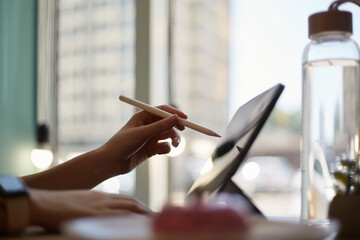 Graphic designer making a new digital sketch with a stylus pen. Freelance illustrator person...