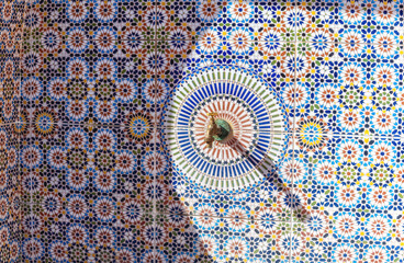 Copper faucet with drinking water on a street in medina, Morocco