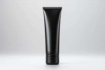 Blank black tube for cosmetic products on a clean light background. Copy space, space for text.