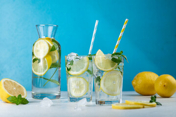 Lemonade with lemon slices, ice and mint leaves