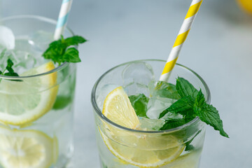 Lemonade with lemon slices, ice and mint leaves