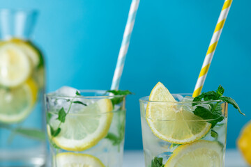Lemonade with lemon slices, ice and mint leaves