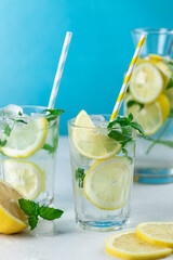 Lemonade with lemon slices, ice and mint leaves