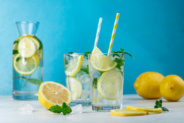 Lemonade with lemon slices, ice and mint leaves