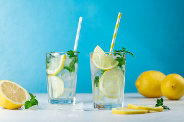 Lemonade with lemon slices, ice and mint leaves