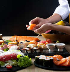 Sushi of japanese, Chef hands preparing japanese food, japanese chef making sushi at restaurant