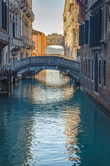 Fototapeta na wymiar Stone bridges with the Bridge of Sighs in Venice at sunny morning, Italy, Europe.