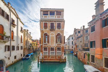 Fototapeta na wymiar The canals with historic buildings in Venice, Italy, Europe.