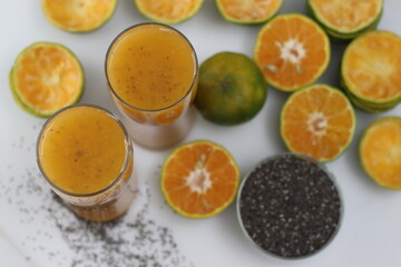 Fototapeta na wymiar Freshly squeezed orange juice with soaked chia seeds