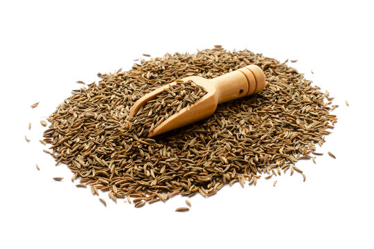 Cumin seeds in a wooden dipper isolated on white background, top view. Heap of cumin seeds in wooden dipper isolated on white background, top view.