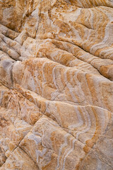 Rock texture in yellow and gray tones.