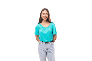 young pretty european woman with black long hair dressed in a blue t-shirt