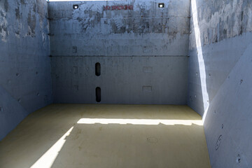 Empty hold on dry cargo vessel. Cargo hold on coaster ship. Commercial shipping. Cargo delivery.