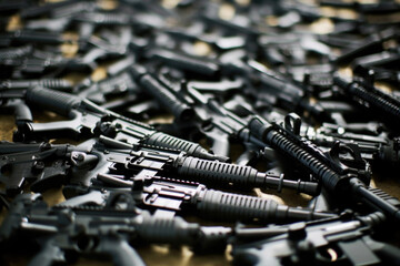 machine guns background in weapons storage. generative ai - obrazy, fototapety, plakaty