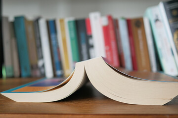 stack of books on wooden table