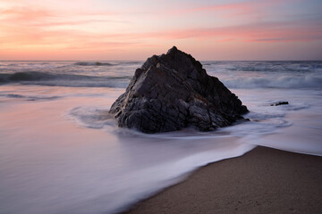 Fototapeta na wymiar The lonely rock, Adraga beach, Sintra, Portugal