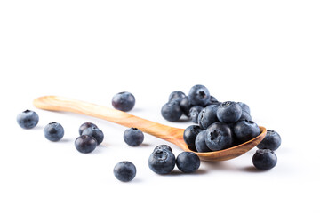 Fresh blueberries in wooden spoon