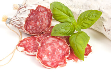 Salami sliced on the white background