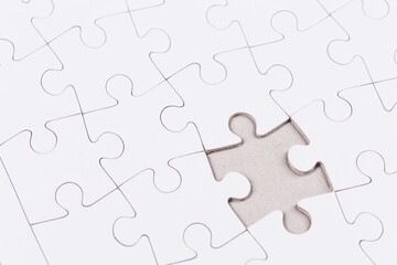 Obraz premium white puzzle jigsaw close up