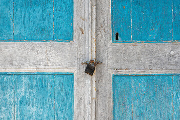 Wooden door of an old stone house in the traditional village of Dilofo in Zagori, Greece