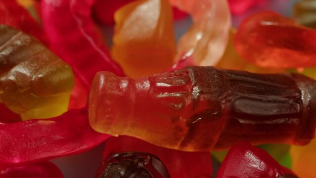 Jelly marmalade cola bottle bear close up, Confiture Bean candy jujube Marmalade bears with cod cannabis close up. 