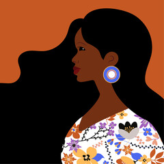 Beautiful black woman. Young african american. Portrait of young woman with beautiful face and hair. Side view. Isolated on orange background.