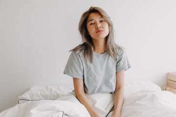 Funny face sleepy head asian woman just wake up in the morning dizzy and lazy.